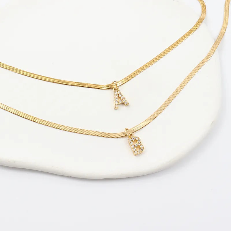 Melly Initial Herringbone Necklace check